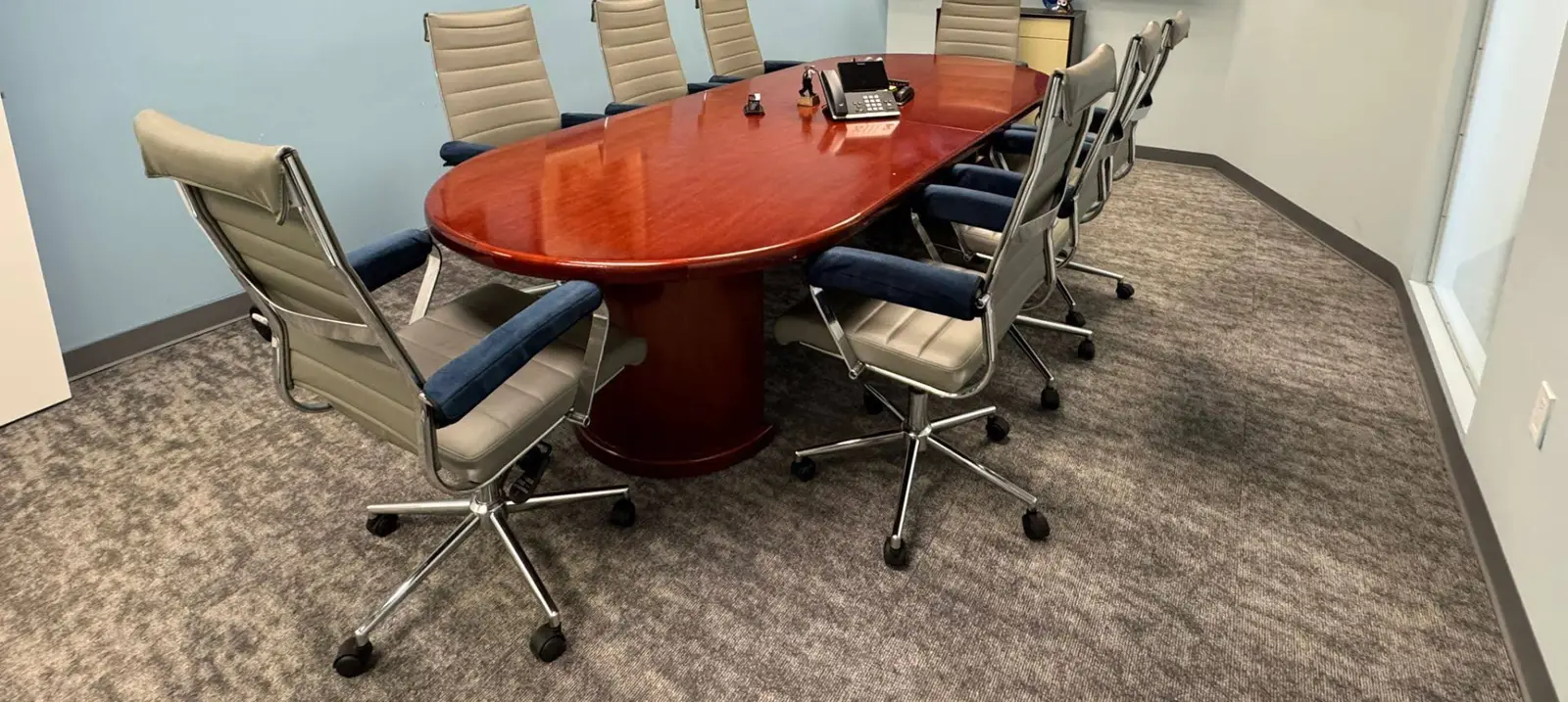 The conference room at Arandia Law Firm with a long wooden table.